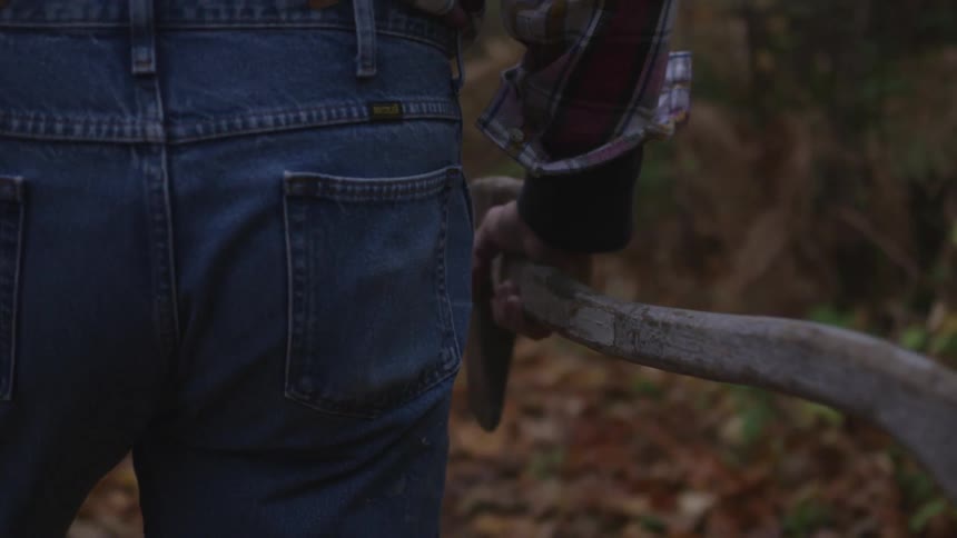 Man In Forest With Weapons