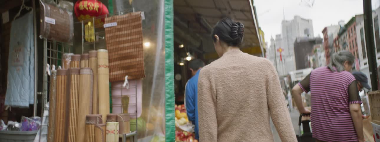 Woman Walking Through Chinatown