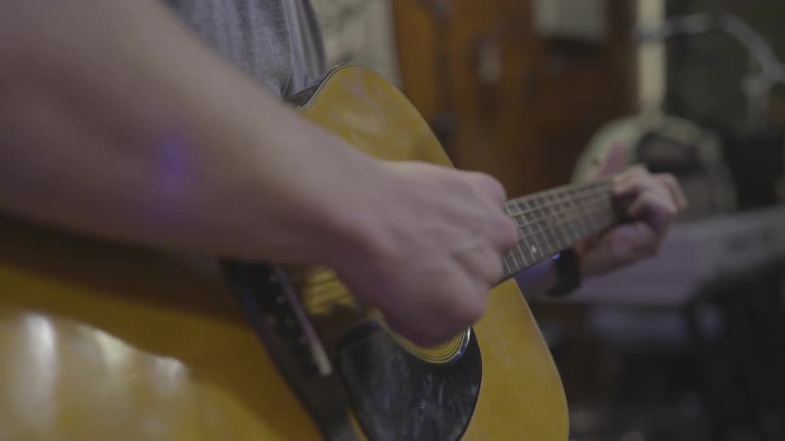 Man Playing Guitar