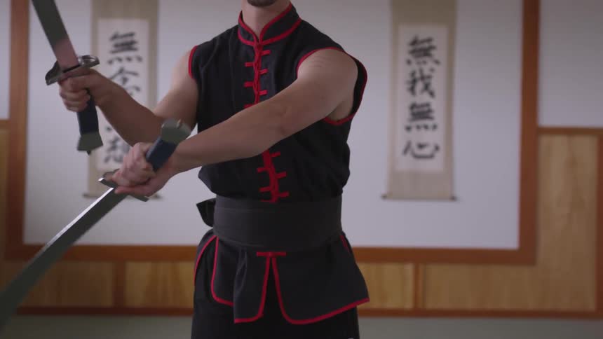 Man Practicing Asian Fighting Techniques