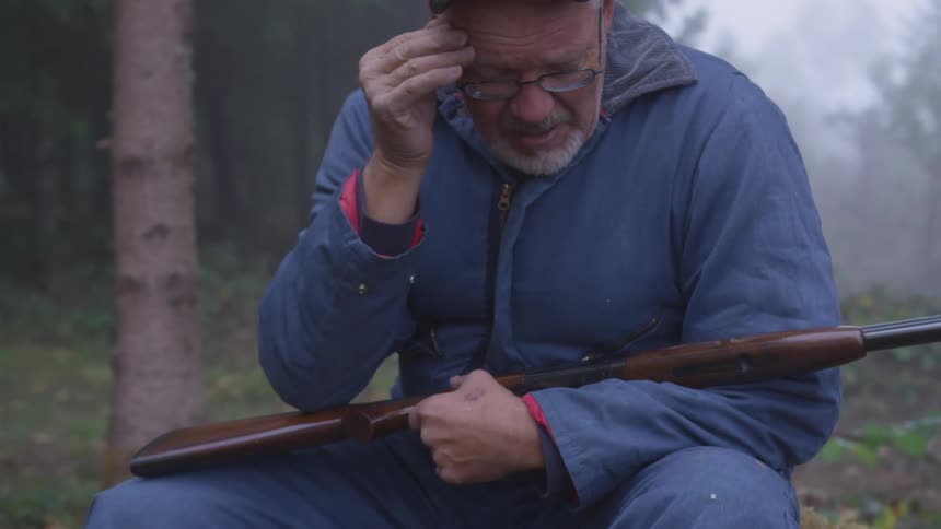 Man In Forest With Weapons