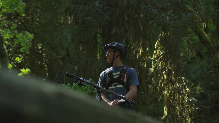 Man Mountain Biking In Forest