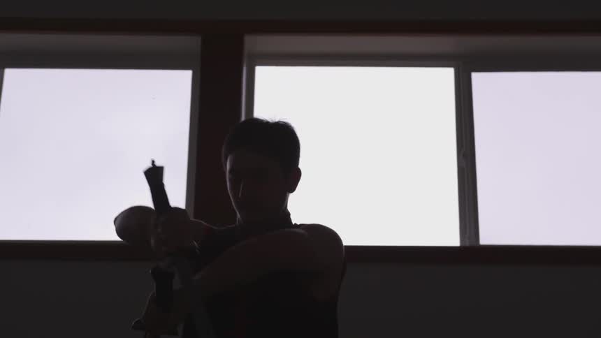 Man Practicing Asian Fighting Techniques