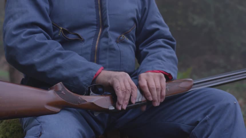 Man In Forest With Weapons