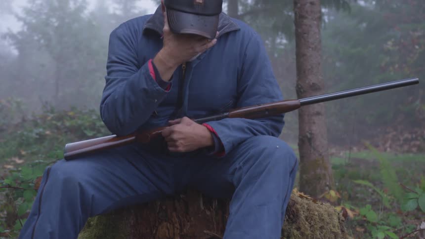Man In Forest With Weapons