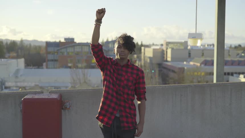 Man On Roof Of Parking Garage