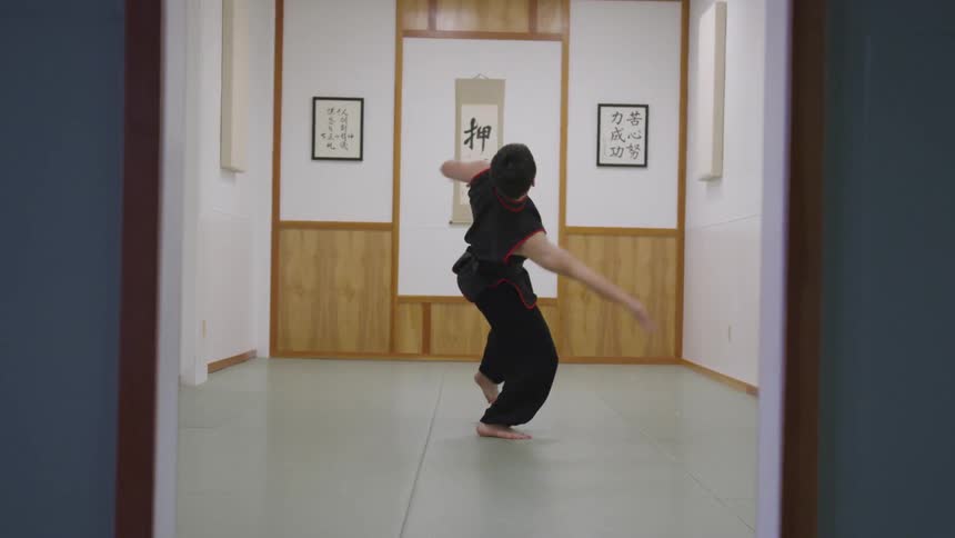 Man Practicing Asian Fighting Techniques