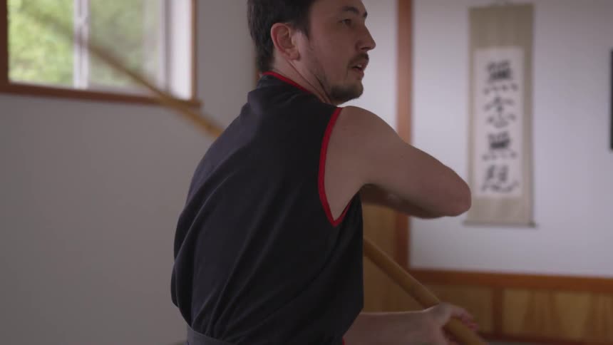Man Practicing Asian Fighting Techniques