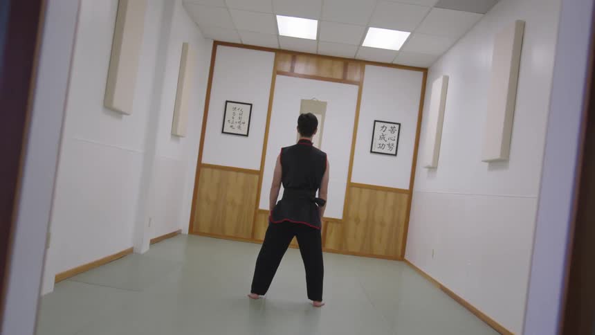 Man Practicing Asian Fighting Techniques