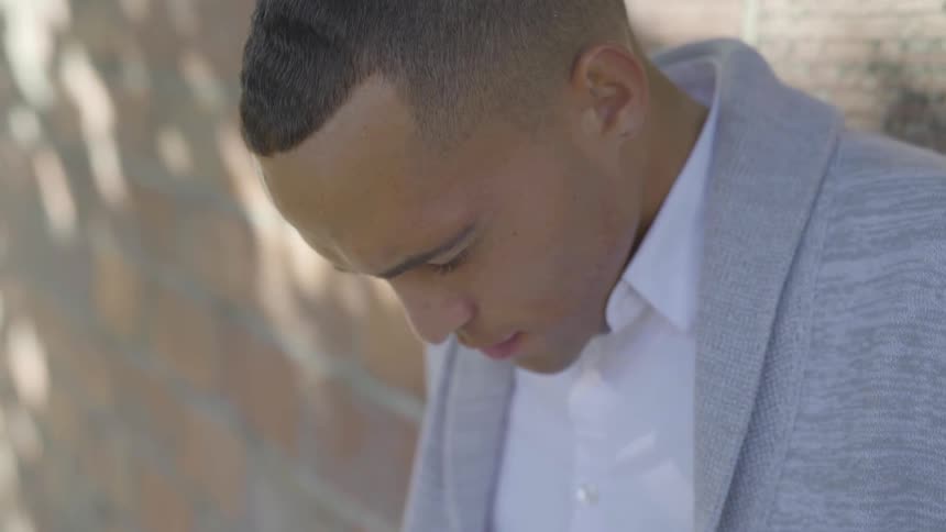 Man Praying And Talking On The Phone
