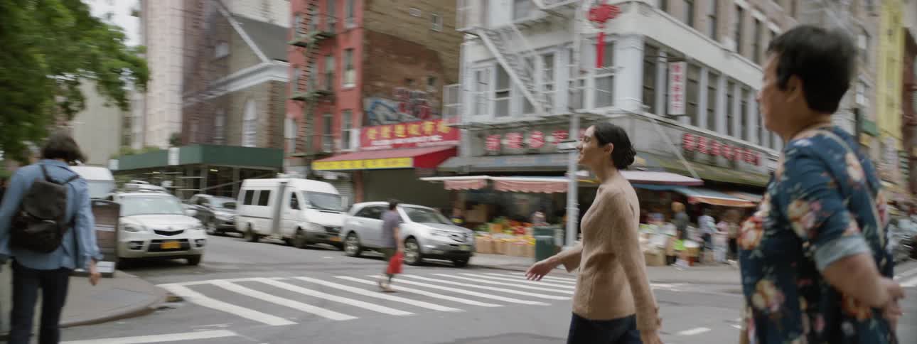 Woman Walking Through Chinatown