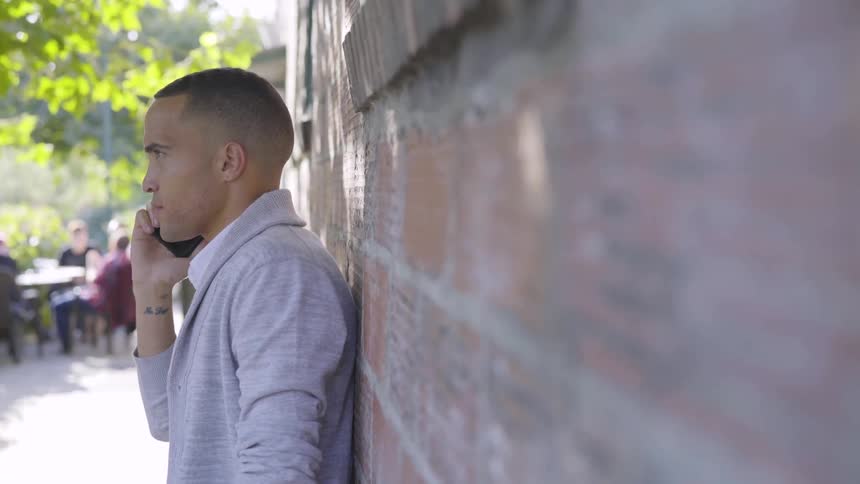 Man Praying And Talking On The Phone
