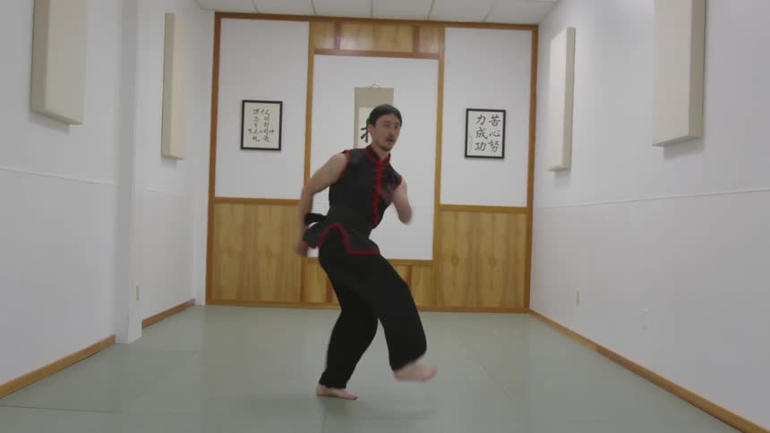 Man Practicing Asian Fighting Techniques