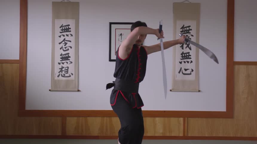 Man Practicing Asian Fighting Techniques