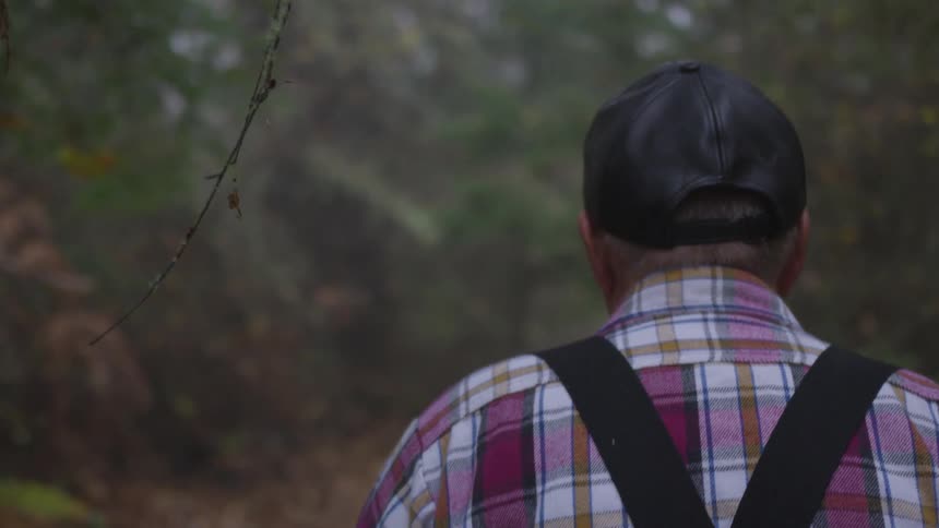 Man In Forest With Weapons