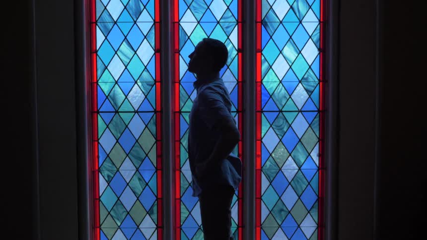 Man Praying At Church