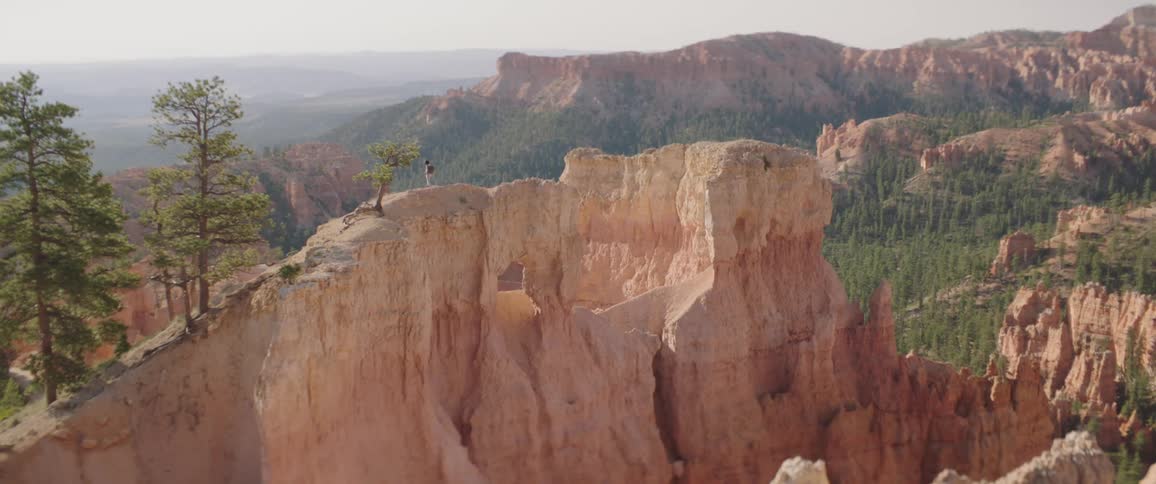 Woman Taking Photos And Exploring Overlook