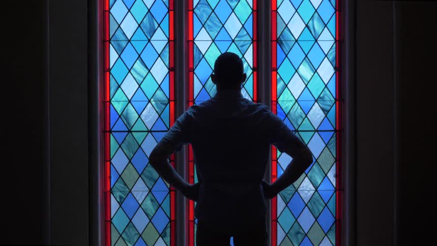 Man Praying At Church