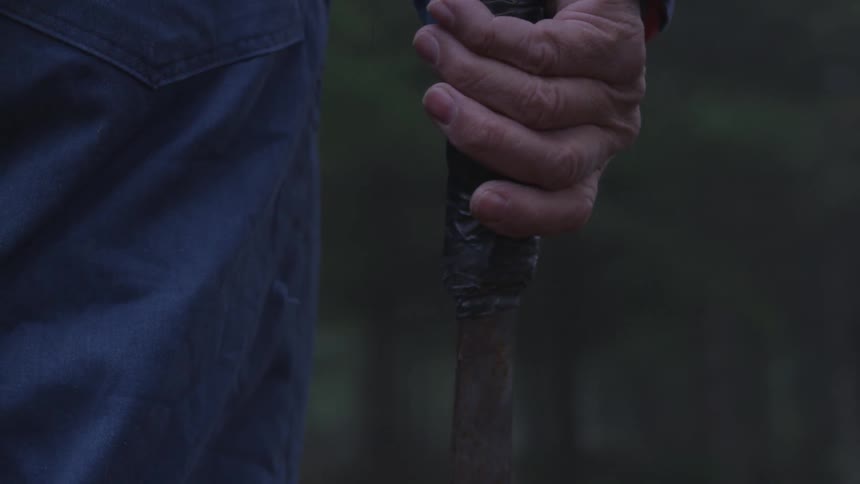 Man In Forest With Weapons