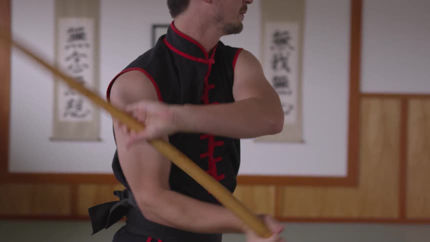 Man Practicing Asian Fighting Techniques