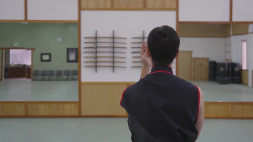 Man Practicing Asian Fighting Techniques