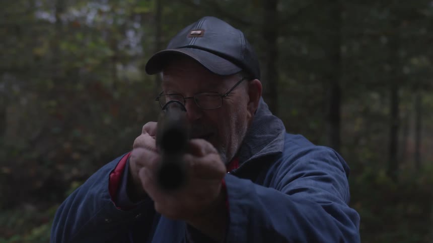 Man In Forest With Weapons