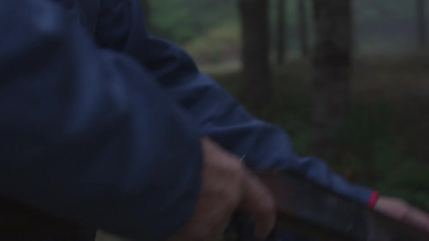 Man In Forest With Weapons