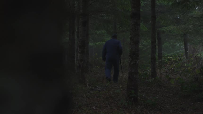 Man In Forest With Weapons