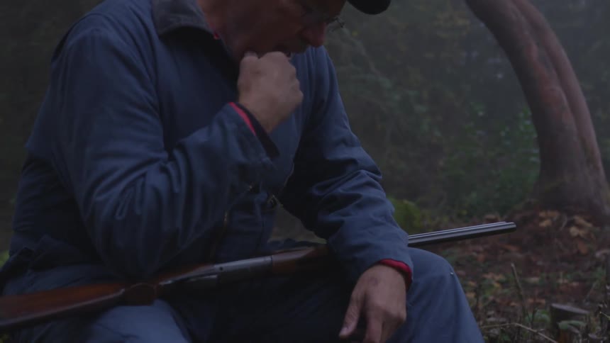 Man In Forest With Weapons