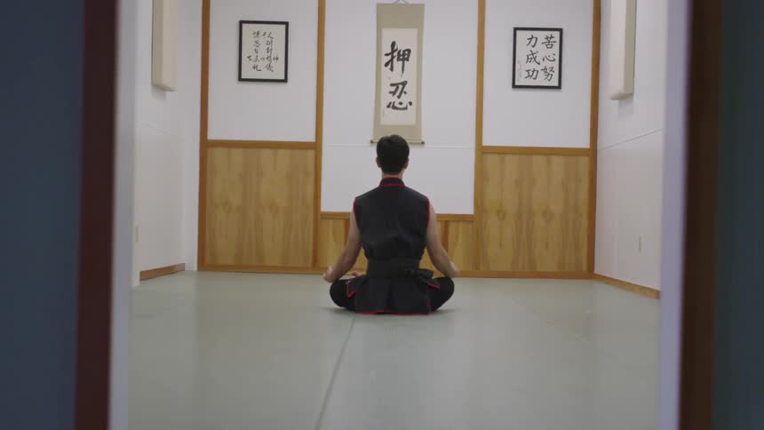 Man Practicing Asian Fighting Techniques