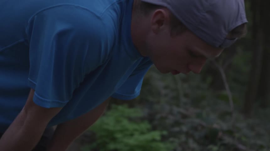 Man Jogging Through Forest