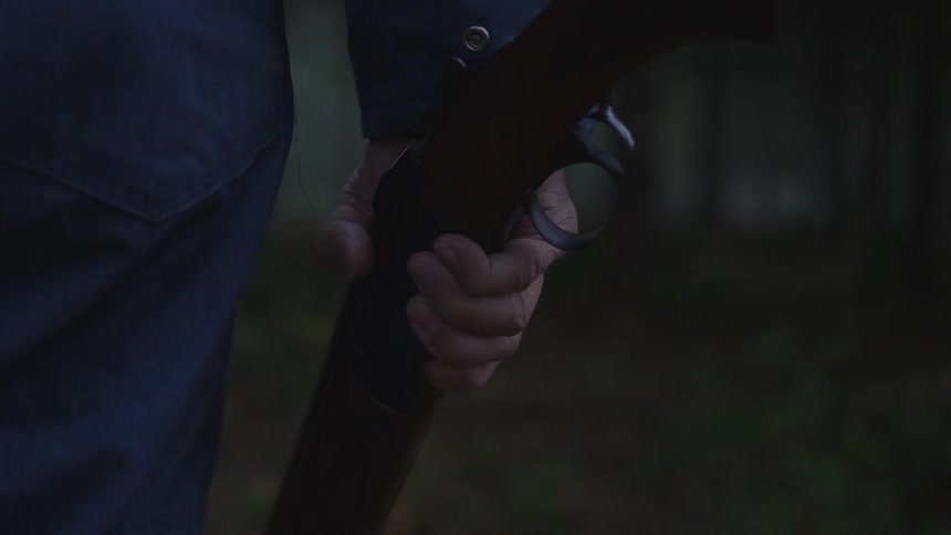 Man In Forest With Weapons