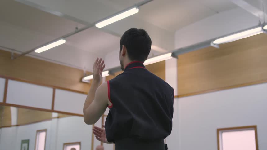 Man Practicing Asian Fighting Techniques