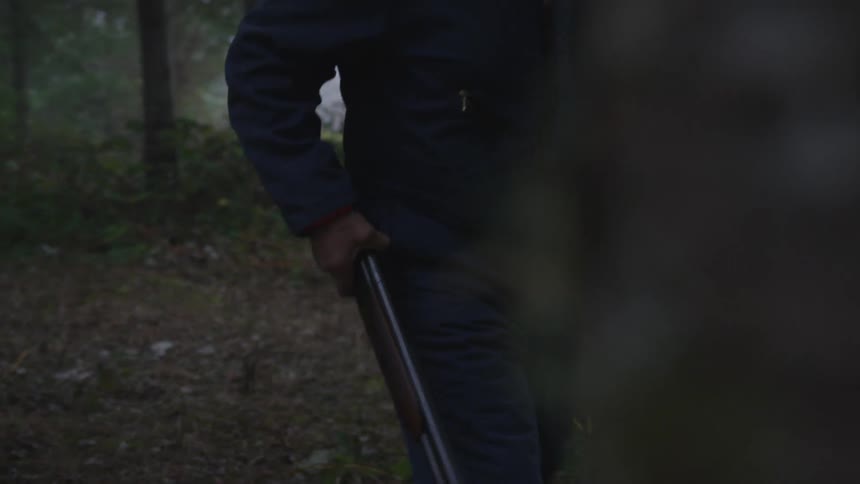 Man In Forest With Weapons