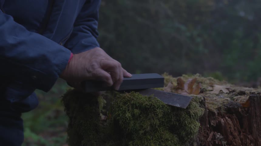 Man In Forest With Weapons