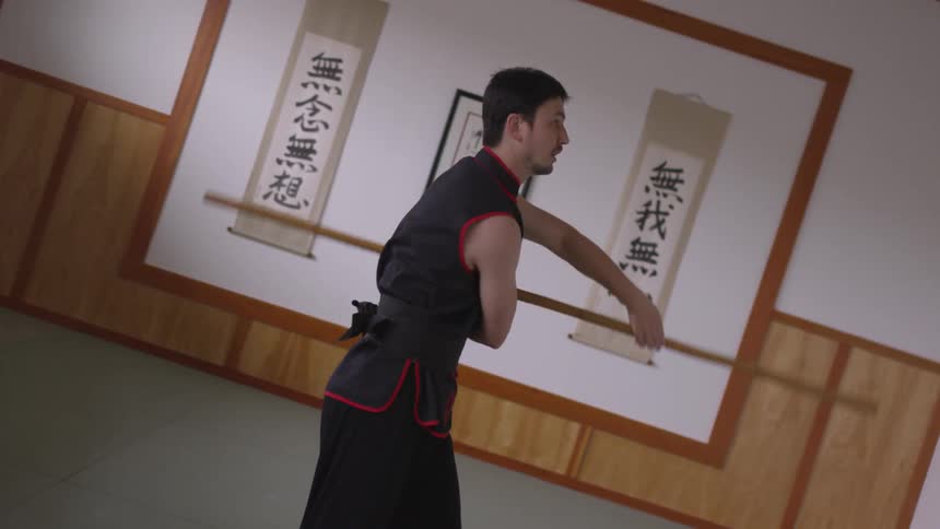 Man Practicing Asian Fighting Techniques