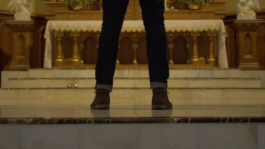 Man Praying At Church