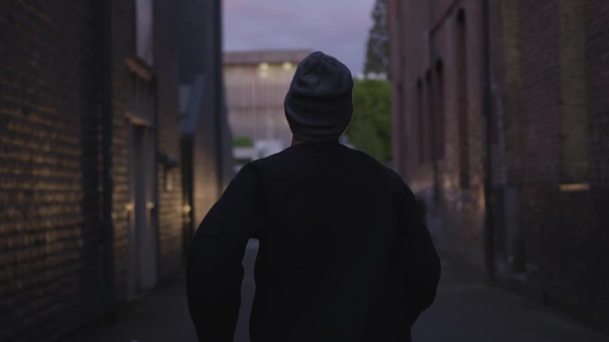 Man Running In Alley