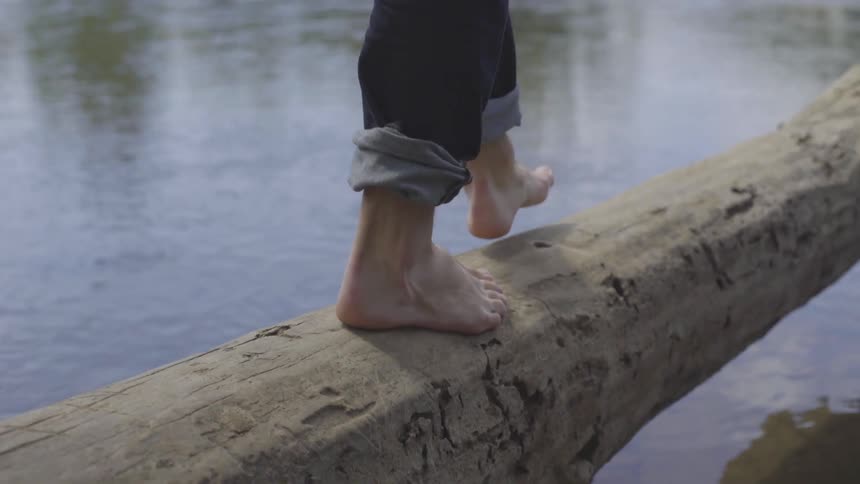 Man Sitting By A River