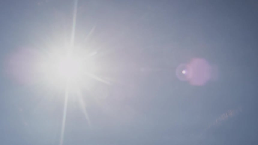 Sun shines bright in a clear blue sky