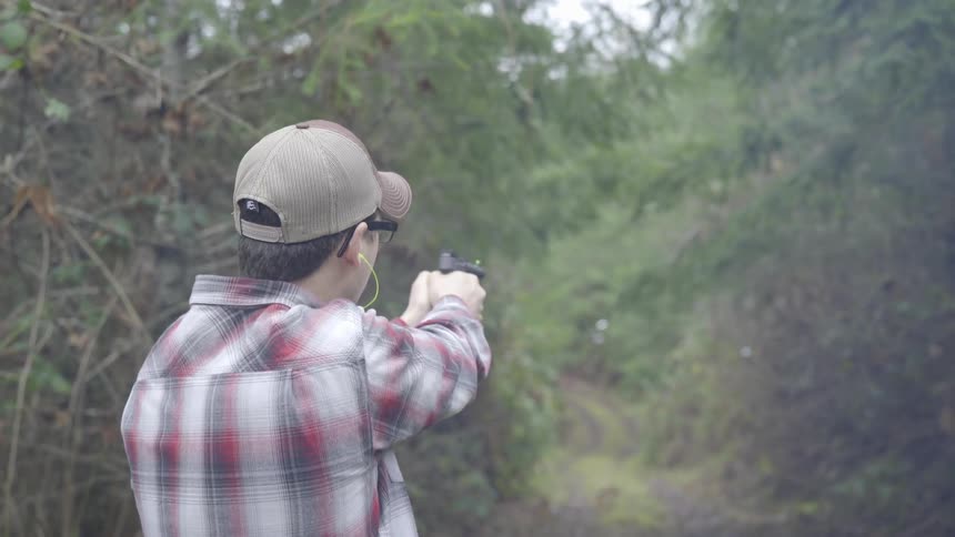Man Shooting Guns Outside