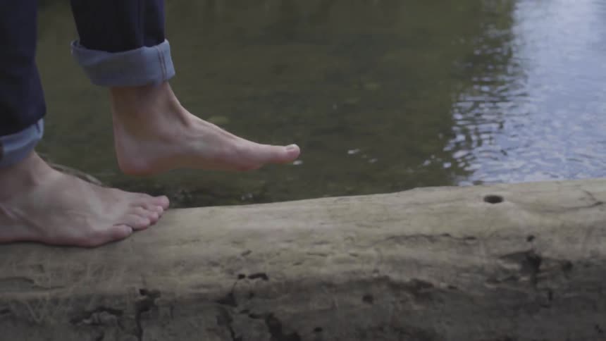 Man Sitting By A River