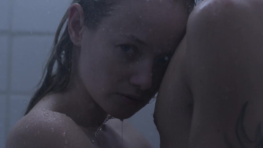 A man and woman taking a shower