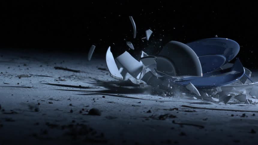 Stack of plates smash against a floor breaking