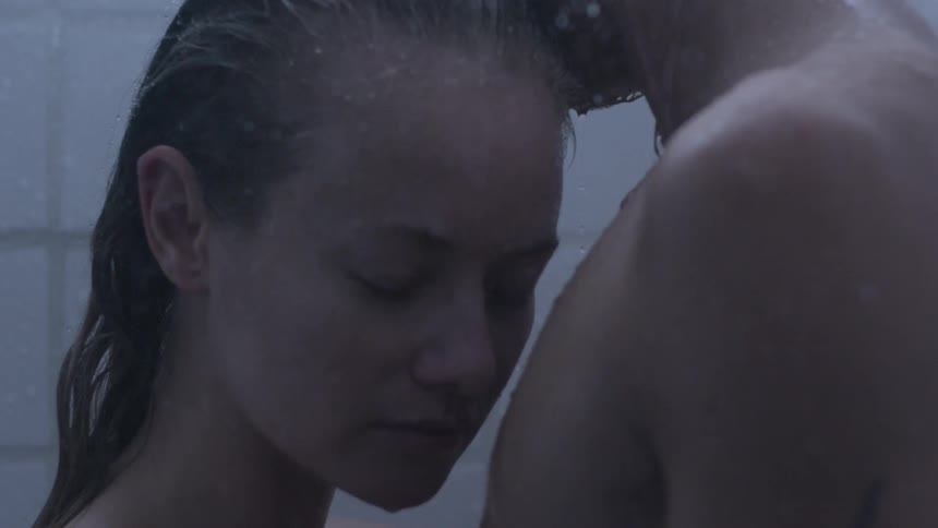 A couple in embrace in a shower