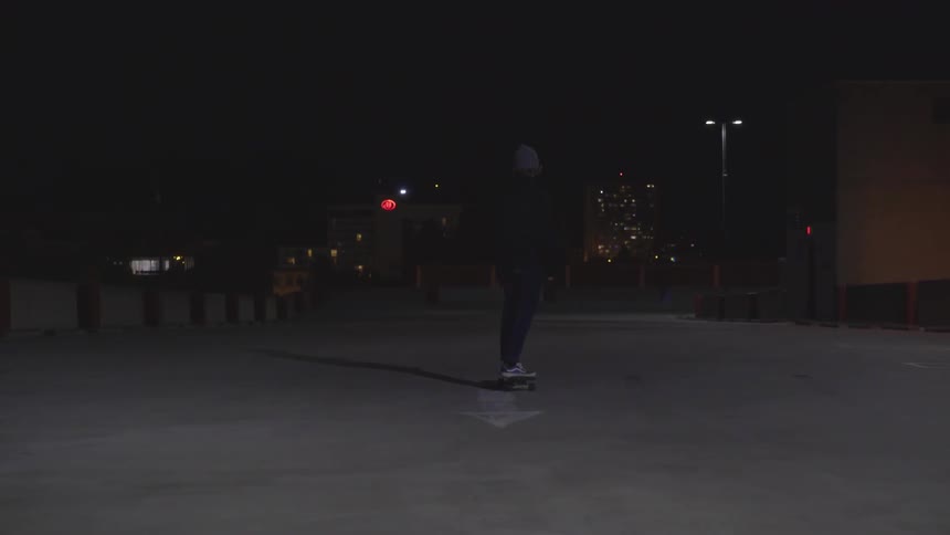 Man Skateboarding At Night