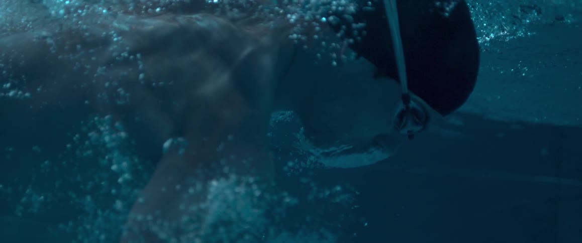 A man swimming in a pool