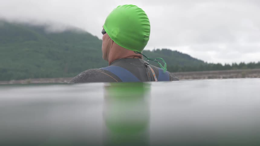 Man Swimming In Lake
