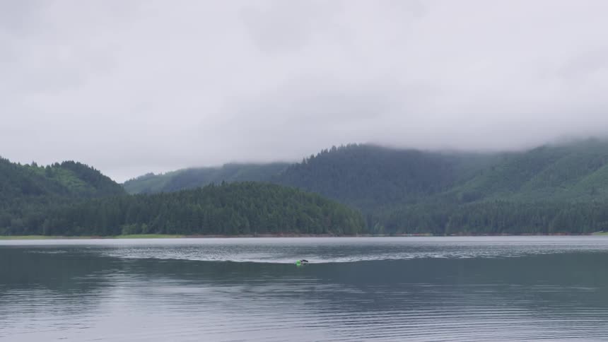 Man Swimming In Lake