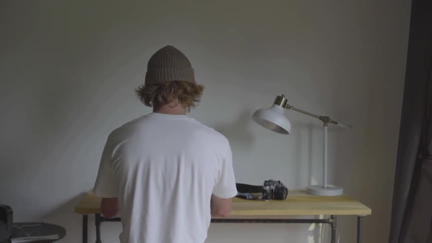 Man Using Laptop At Desk